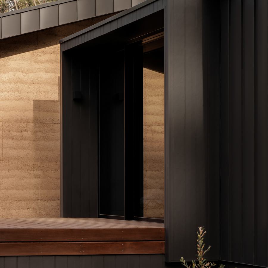 Kinglake. Rammed earth and black steel, set into the forest.
